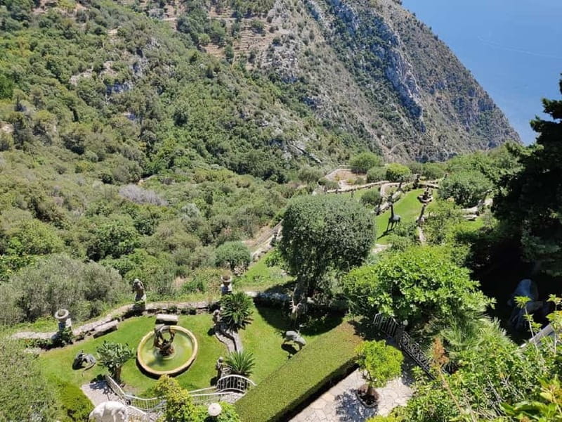 Èze: Walking Tour with a Local Guide - Notre-Dame de l’Assomption: ochre walls, a clocked bell tower, and interior details