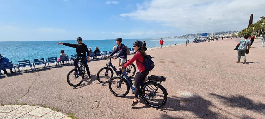 Cyclists on the Promenade des Anglais above the Baie des Anges