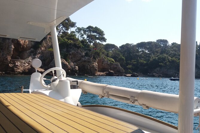 Private ride with sea bath in Solar Catamaran - Stop 1 at Cap d’Antibes: cliffs, a pebbly shore, and clear-water snorkeling
