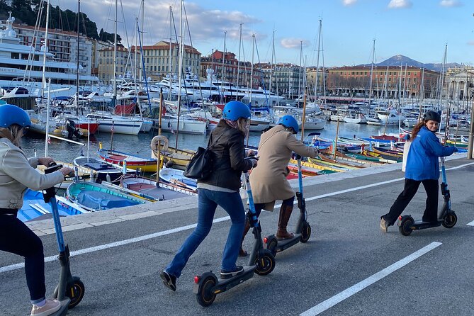 The essentials of Nice by electric scooter 1H30 - Marina time: yachts, fishing boats, and crystal-clear water